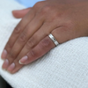 lady wearing Tiffany & Co. Baguette Cut Diamond and 18 Carat White Gold Wedding Band Ring