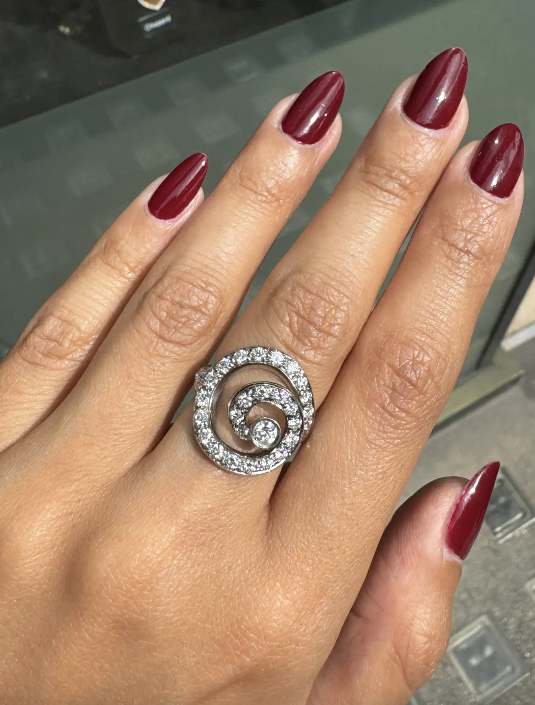 lady wearing Asprey Diamond and 18 Carat White Gold Swirl Cocktail Ring side view