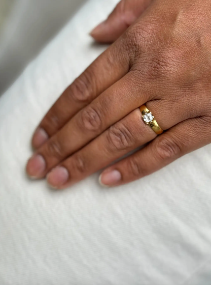 lady wearing an Antique Old Mine Cut Diamond and 22 Carat Yellow Gold Solitaire Engagement Ring