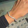 Princess Cut Diamond and 18 Carat Yellow Gold Thin Wave Bangle Bracelet
