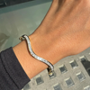Princess Cut Diamond and 18 Carat Yellow Gold Thin Wave Bangle Bracelet
