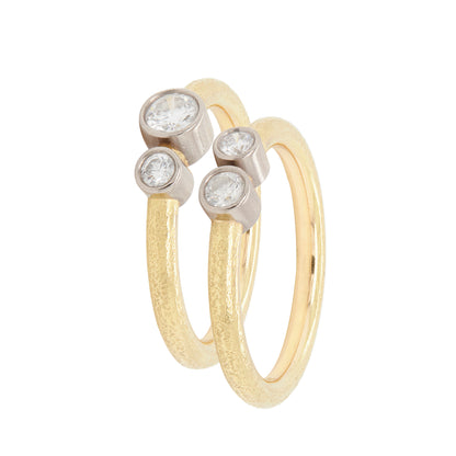 Pair of 18 Carat Yellow and White Gold Rub-Over Diamond Stacking Rings
