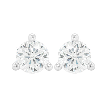 A pair of 18 carat white gold stud earrings with a clear, heart-shaped butterfly back and a central diamond.