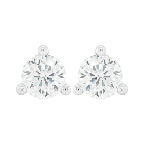 A pair of 18 carat white gold stud earrings with a clear, heart-shaped butterfly back and a central diamond.