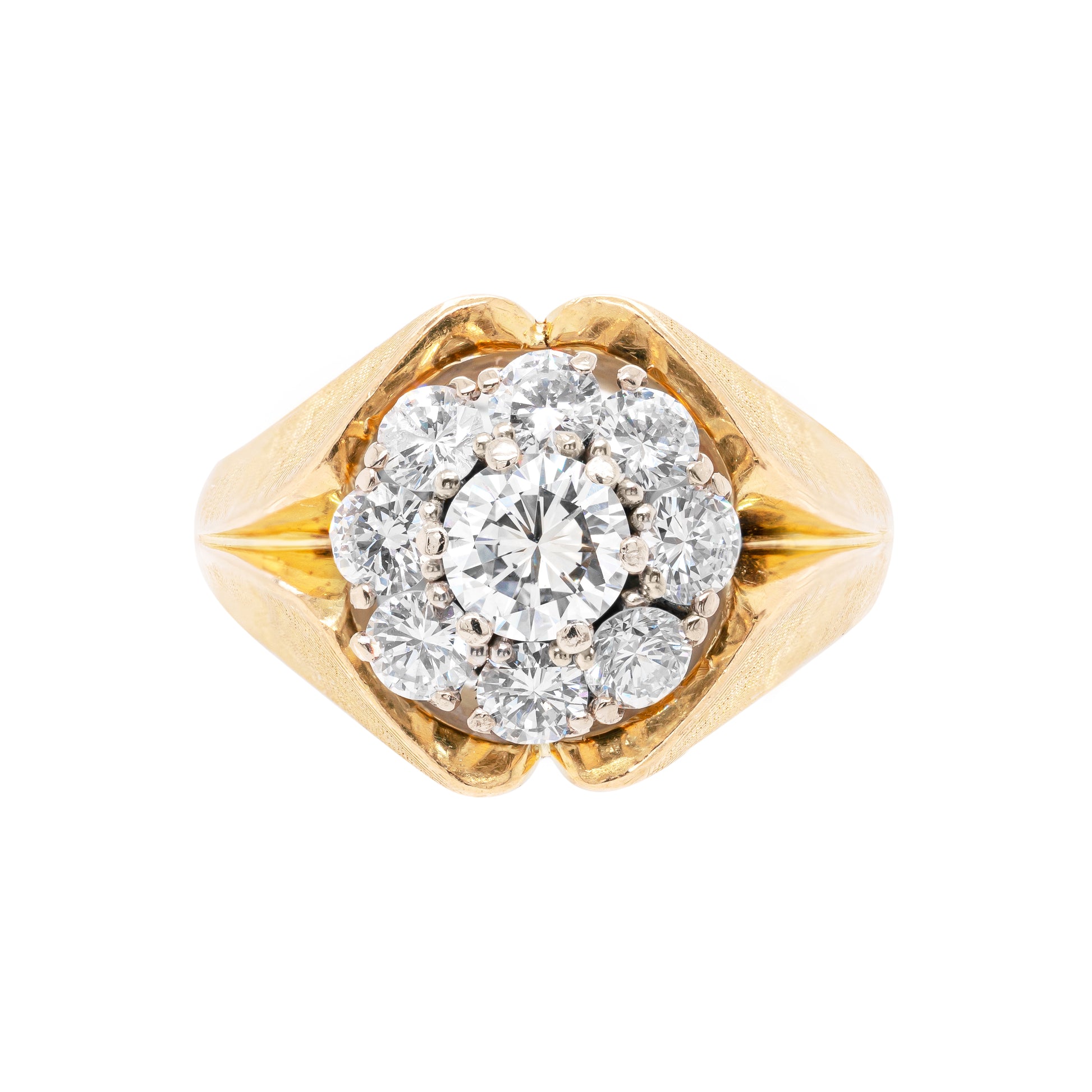 A vintage diamond 18 carat yellow gold cluster ring with a central diamond cluster surrounded by smaller round brilliant cut diamonds set in an 18 carat yellow gold mounting.