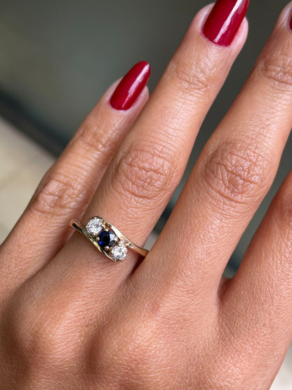 Blue Sapphire and Diamond Three-Stone 14 Carat Yellow Gold Crossover Engagement Ring