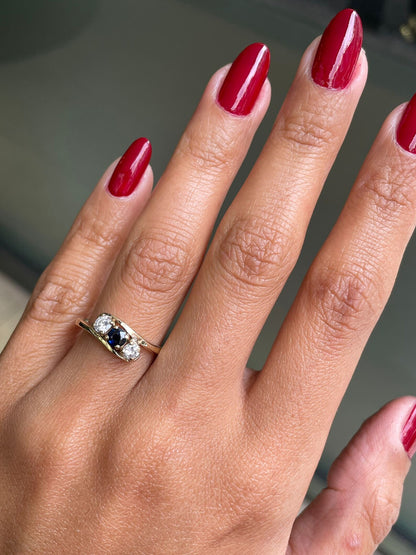 Blue Sapphire and Diamond Three-Stone 14 Carat Yellow Gold Crossover Engagement Ring