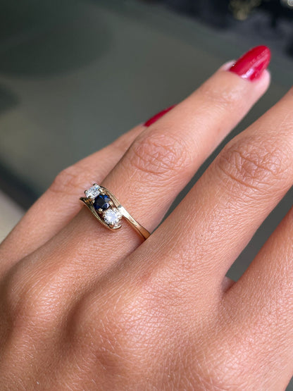 Blue Sapphire and Diamond Three-Stone 14 Carat Yellow Gold Crossover Engagement Ring
