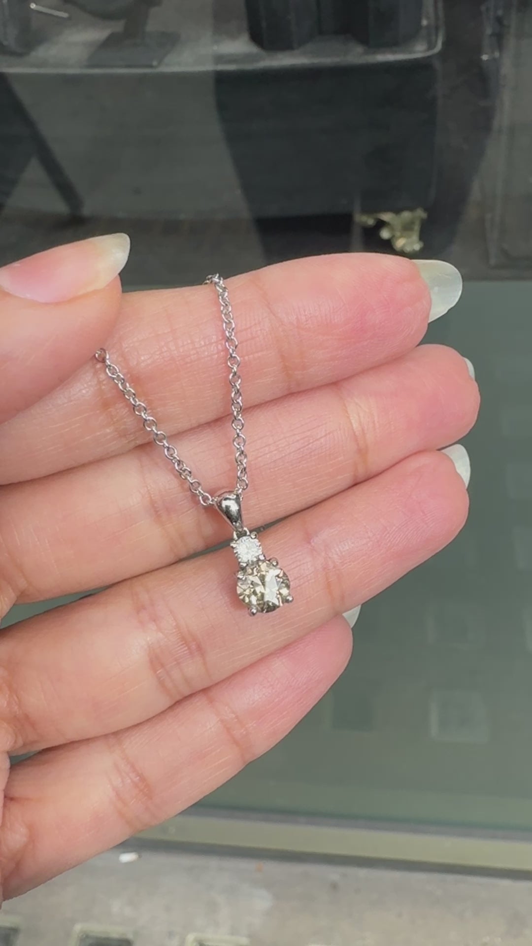 a video of 0.80ct Fancy Brown Diamond 18 Carat White Gold Two Stone Pendant