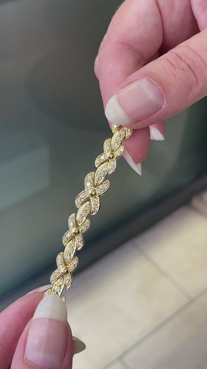 18ct yellow gold bracelet with 1.25ct diamonds set in alternating ‘X’ and bar links.