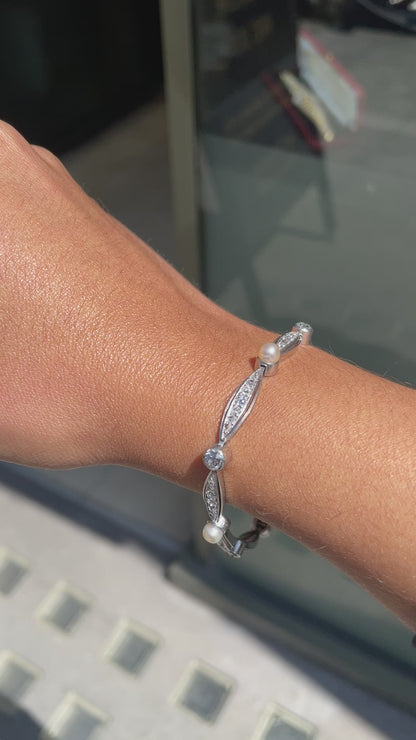 video of person wearing French Pearl and Diamond Platinum Bracelet, Circa 1910