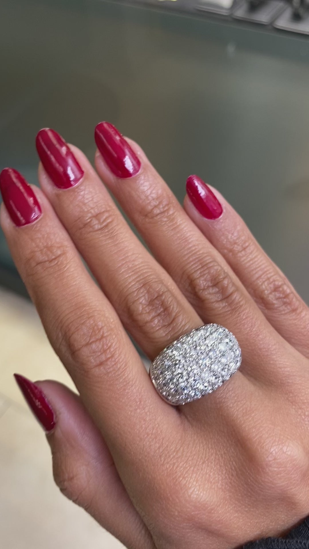A video of a stunning bombé cluster ring set with 63 fine quality round brilliant cut diamonds 