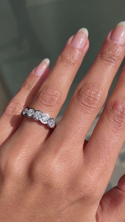 1.20ct diamond half eternity wedding band in platinum with five round brilliant cut rubover set diamonds