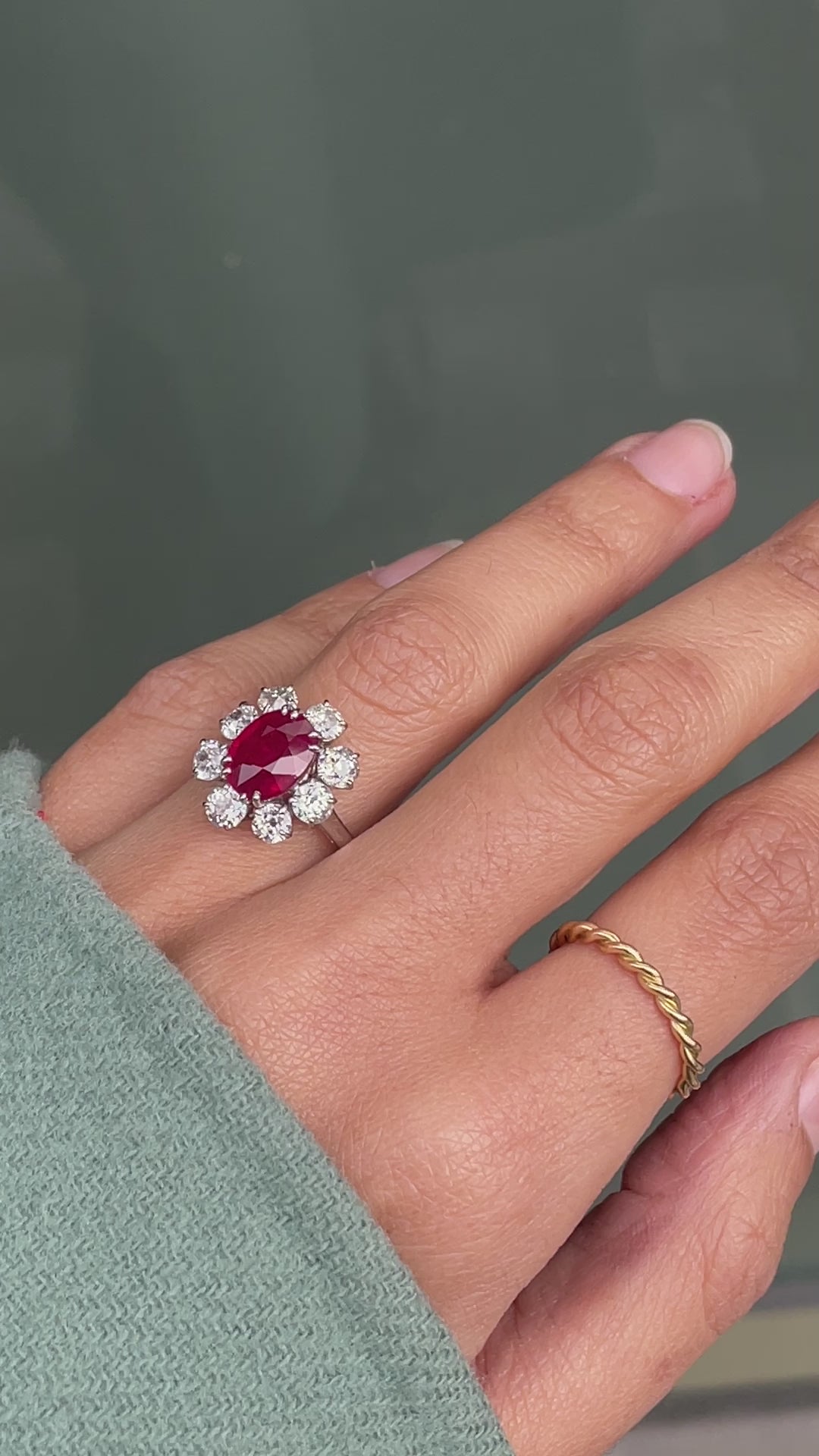 An 18ct white gold ruby and old cut diamond cluster engagement ring with French hallmarks on hand