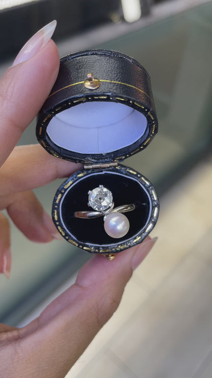 video of An antique pearl and diamond toi et moi engagement ring set in a white gold band