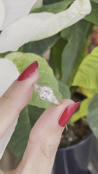 video of 0.95 Carat Old Cut Diamond Engagement Ring with 6 smaller diamonds set in Platinum on hand