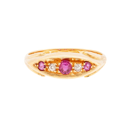 An 18 carat yellow gold five-stone ring with three round rubies and two old cut diamonds set in the band.