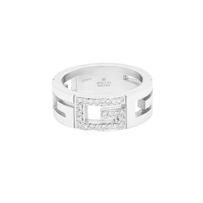 An 18 carat white gold open work G logo diamond band ring with multiple cut-out diamonds around the band.